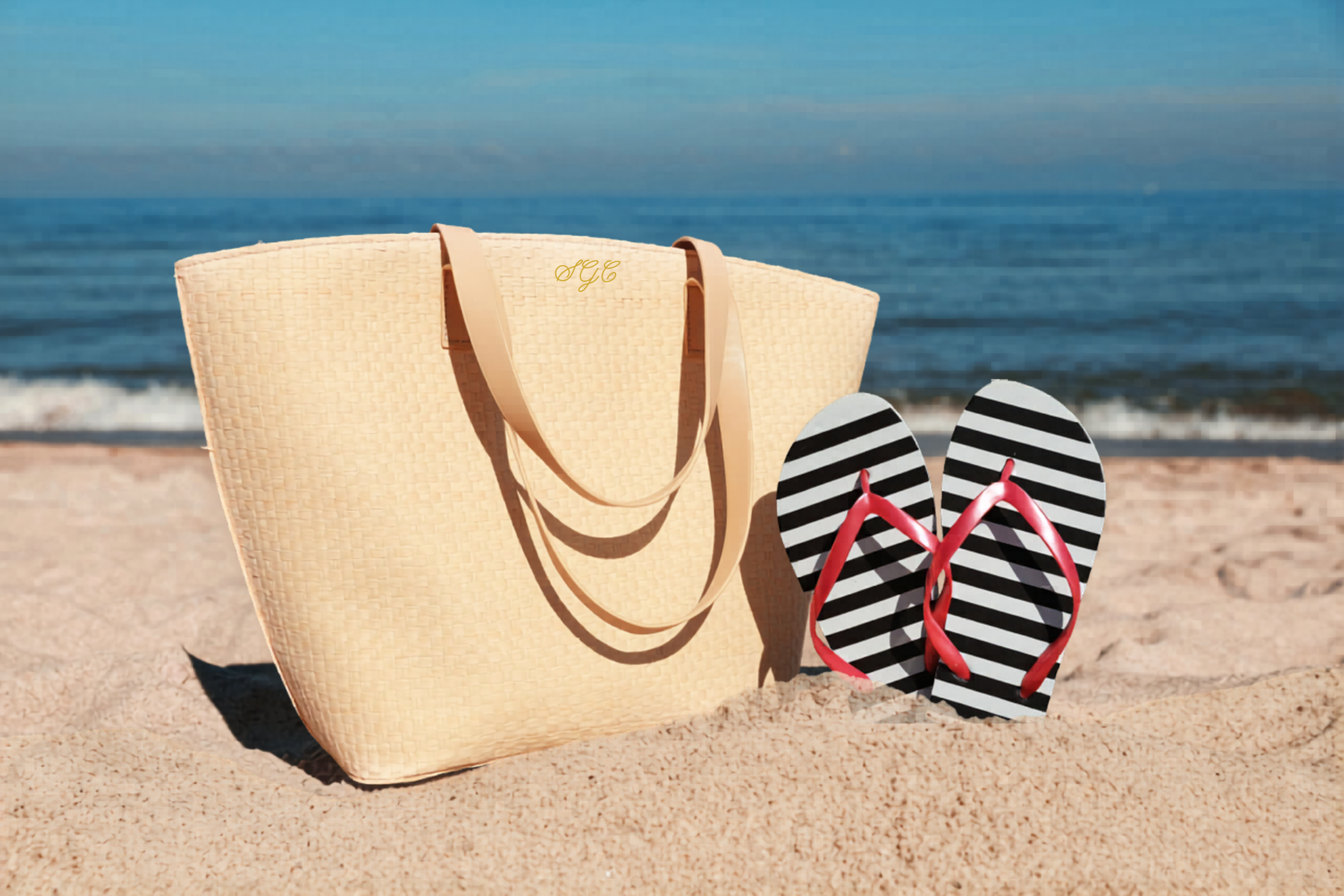 Summer bag and flip flops on beach